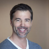 Mature man smiling at home